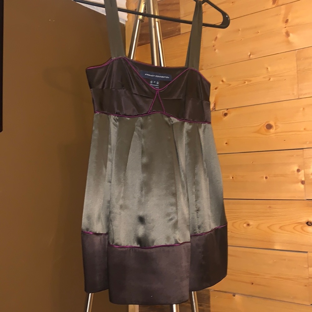 Silk camisole with purple piping detail. Color is a two-toned gun metal.